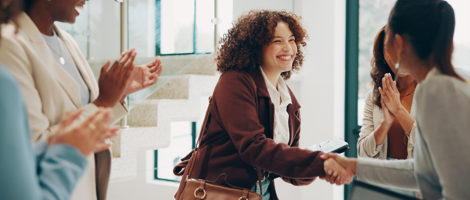 Job candidate shaking hands during a professional interview.