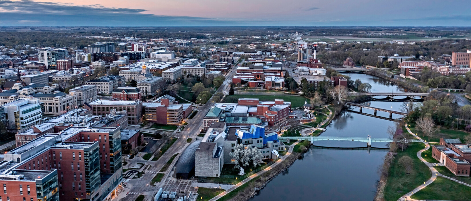 Aerial view of an Iowa metro area with a river running through the city.