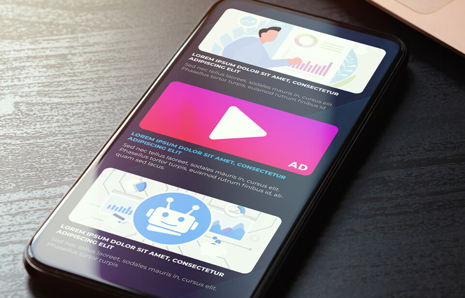 Smartphone displaying digital ad placements and marketing content.