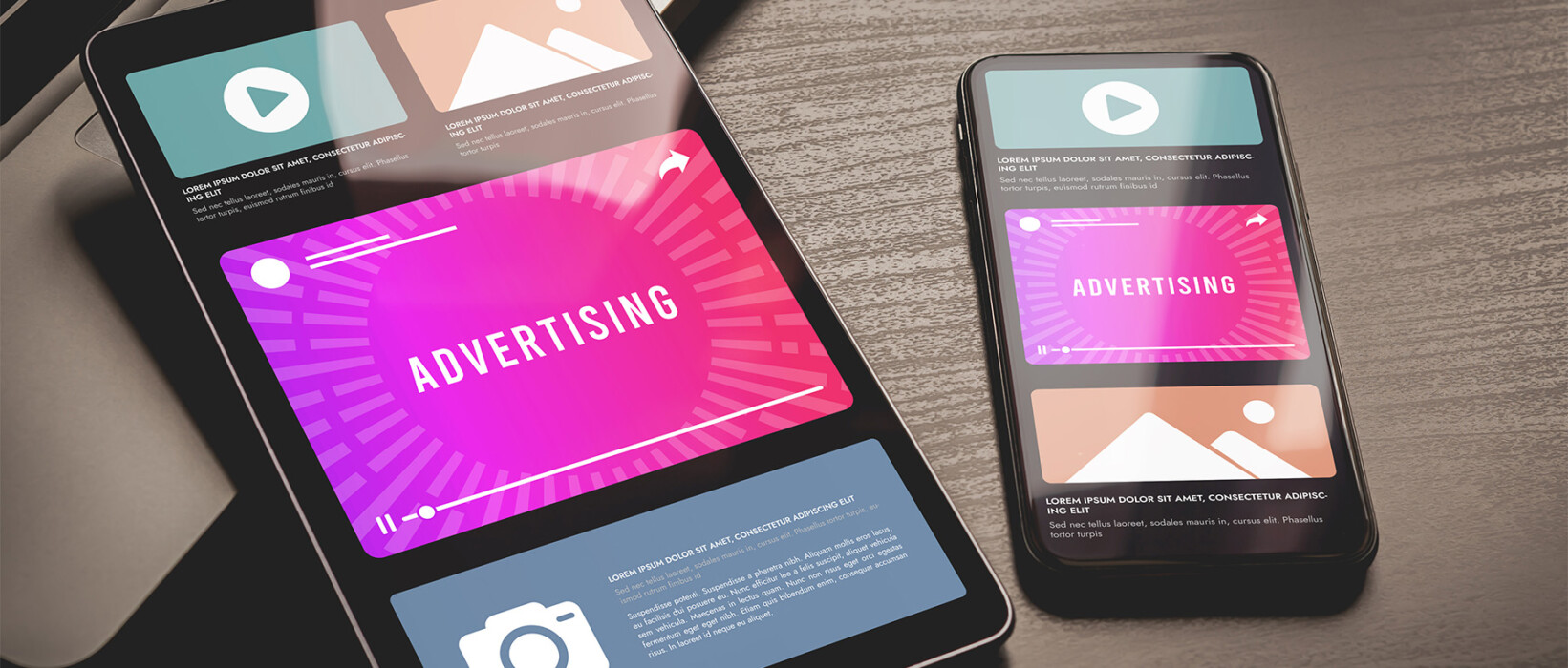 Tablet and smartphone displaying digital advertising layouts.
